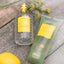 4711 Acqua Colonia Lemon & Ginger Flakon und Duschgel neben Fenchelblüten und Zitrone