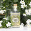 4711 Floral Collection Jasmine steht vor Jasminblüten